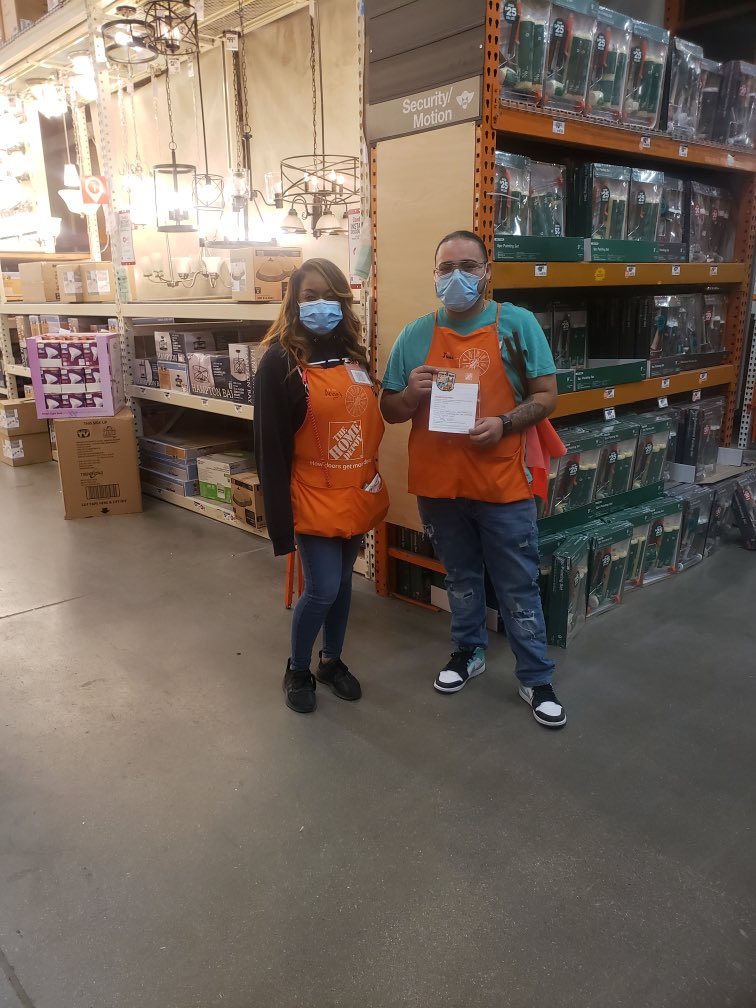 Department supervisor Angel awarding Juan For an outstanding performance Thank you for all you do.#takingcareofourassociates