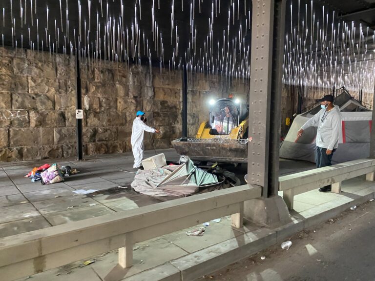 DCist's tweet image. D.C. has suspended its clearing of a longstanding homeless encampment in NoMa after an unhoused person in a tent was hit by a city bulldozer. dcist.com/story/21/10/04…