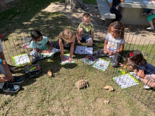 Mrs Pollock and Ms. Garrigues know that if your class is writing about a tortoise, it's probably best to have a tortoise present.   #dunlapdoesawesome