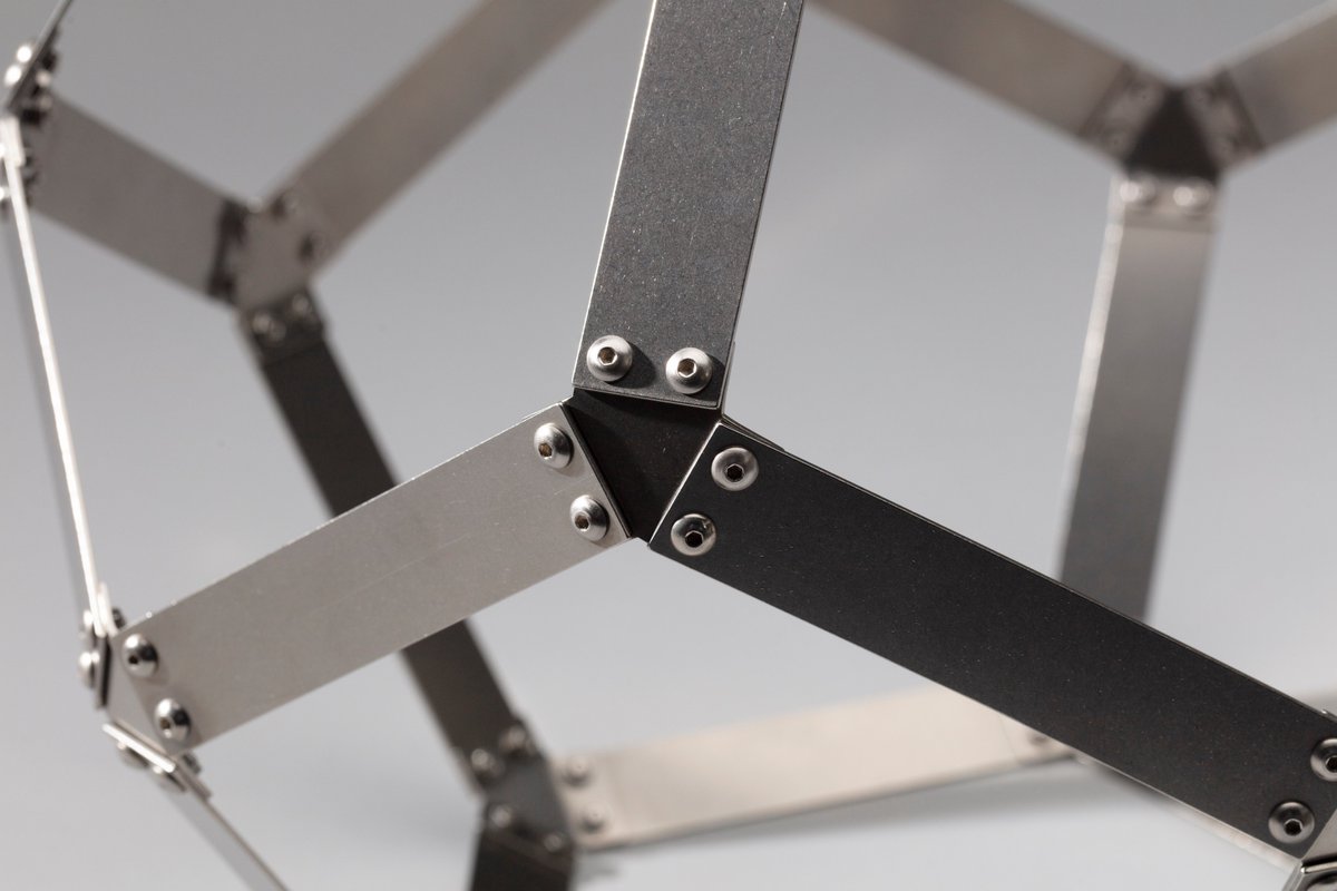 SFOMuseum's tweet photo. The light, elegant aesthetic of these sculptures shows the power of mathematical ideas: with only a minimal amount of material, the unique character of a polyhedron comes to light.  #MathAtSFO https://t.co/UaRG0kpvab