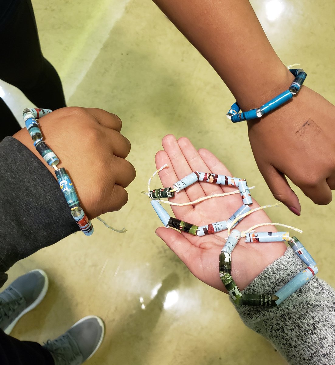 VJAGreenTeam's tweet photo. So much creativity on Green Team!! Check out the cool paper bead jewelry GT made from repurposed magazine pages! ♻️ @AndrewHS_d230 https://t.co/UfezrP8tmS