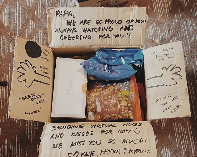 MeralcoBolts's tweet photo. WHY WE PLAY. ⚡ Here in the #PBABubble, we always look forward to the weekly deliveries from our families. @alleinmaliksi's boxes arrived covered with messages from his wife and kids—complete with a drawing of arms for a "virtual hug." #BoltsFamily https://t.co/toDsQIqJLy