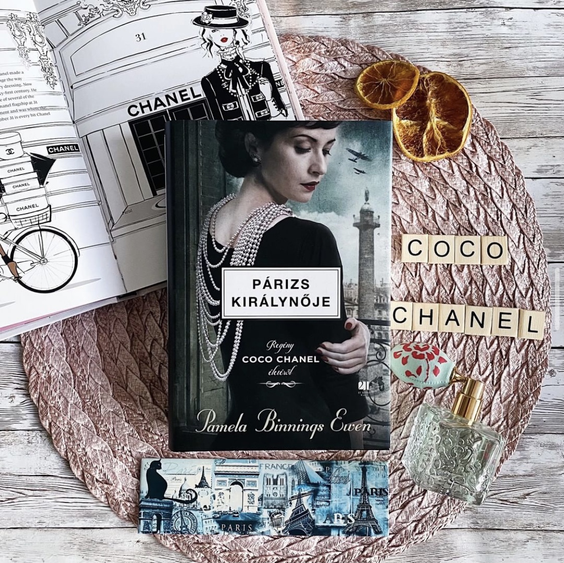 pamelabewen's tweet photo. Some wonderful #bookscapes of the international copy of The Queen of Paris from publisher #21századkiadó. I love the reoccurring themes, yet different approaches in each photo. I appreciate how I can connect with readers and #booklovers from all over the world! #WritingCommnunity https://t.co/igUoeuntYt