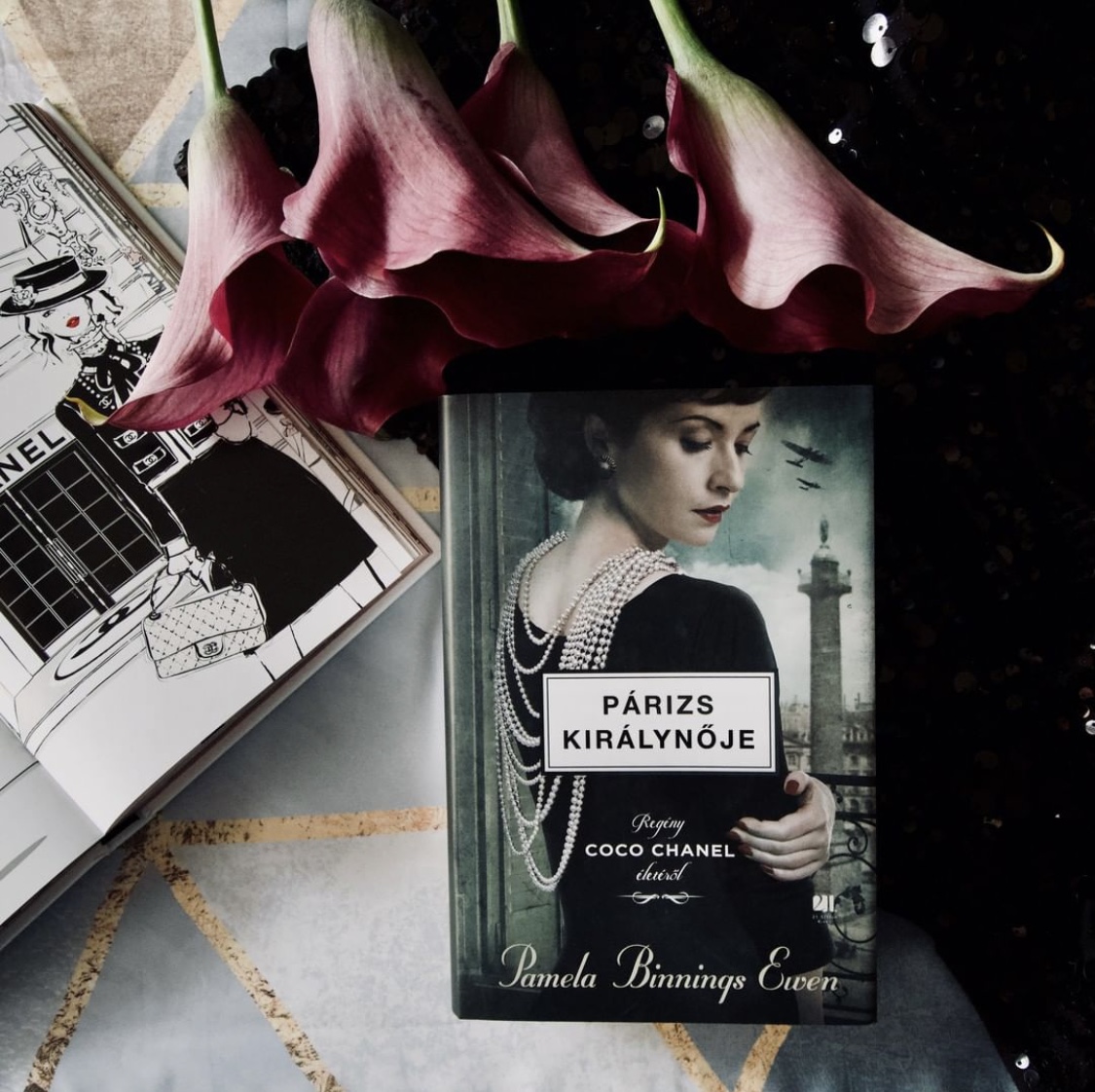 pamelabewen's tweet photo. Some wonderful #bookscapes of the international copy of The Queen of Paris from publisher #21századkiadó. I love the reoccurring themes, yet different approaches in each photo. I appreciate how I can connect with readers and #booklovers from all over the world! #WritingCommnunity https://t.co/igUoeuntYt