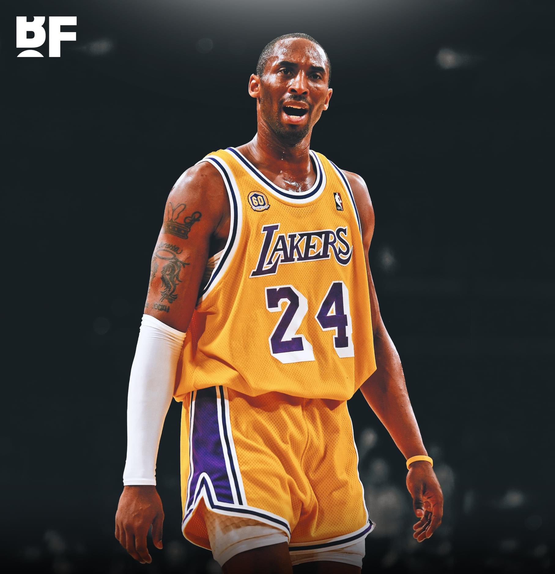 Kobe Bryant grabs his shorts in a Laker road jersey.JPG