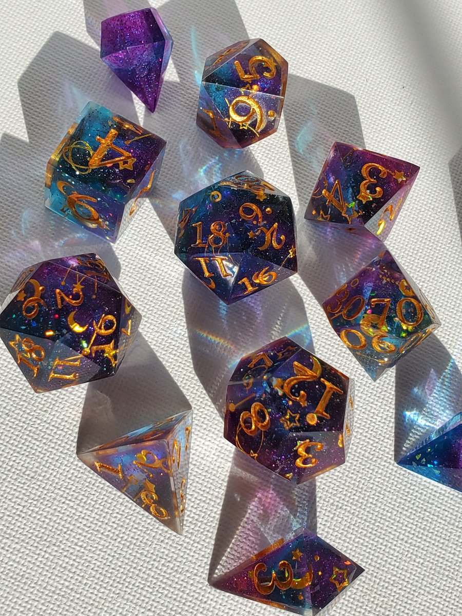 CritCandyDice's tweet photo. Astromancer, a sweet star themed set that I'm delighted with the results of. #resindice #dice #dnddice #ttrpgdice #sharpdice https://t.co/od53wyskHZ