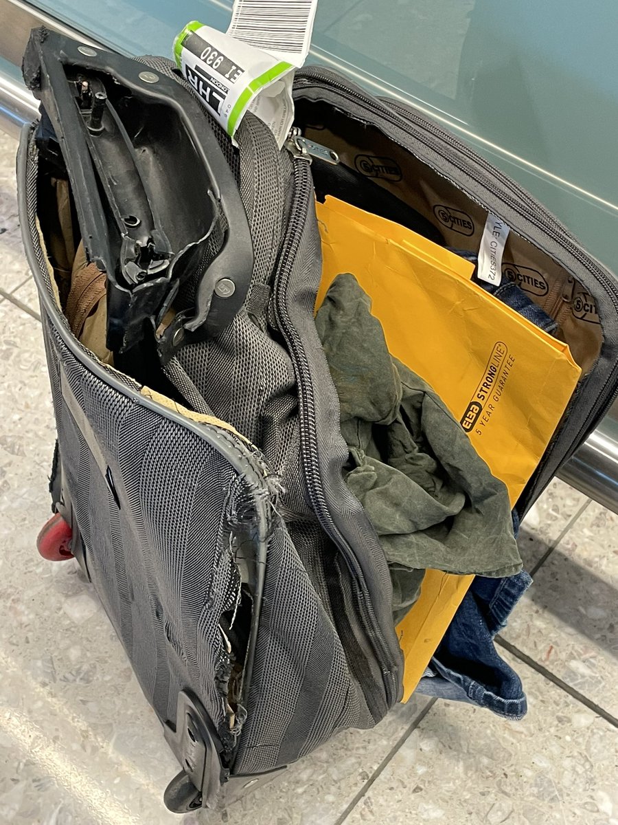 RuthEMcCarthy's tweet photo. Arrived in @heathrow_airport,  this is my hold bag, smashed beyond recognition, like it was run over by a truck. Papers destroyed, favourite shirt ripped up at the back. They weren’t even going to replace it until i refused to leave til they did. Barely an apology. #aerlingus🍀 https://t.co/AL4fEvRr51