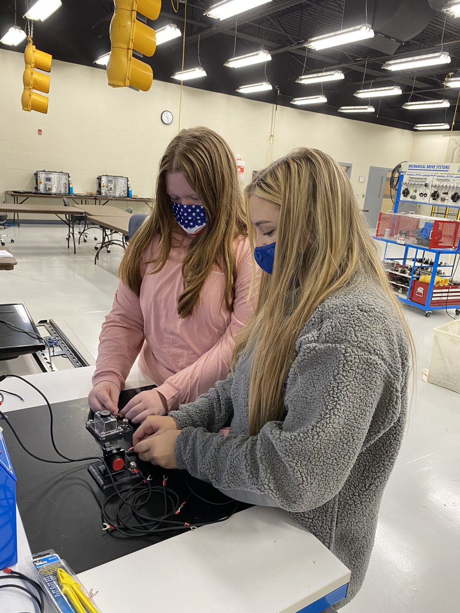 JessGS717's tweet photo. Electrical systems technology… Making circuits. Love the traffic lights hanging from the ceiling! https://t.co/zR8sYQZocP