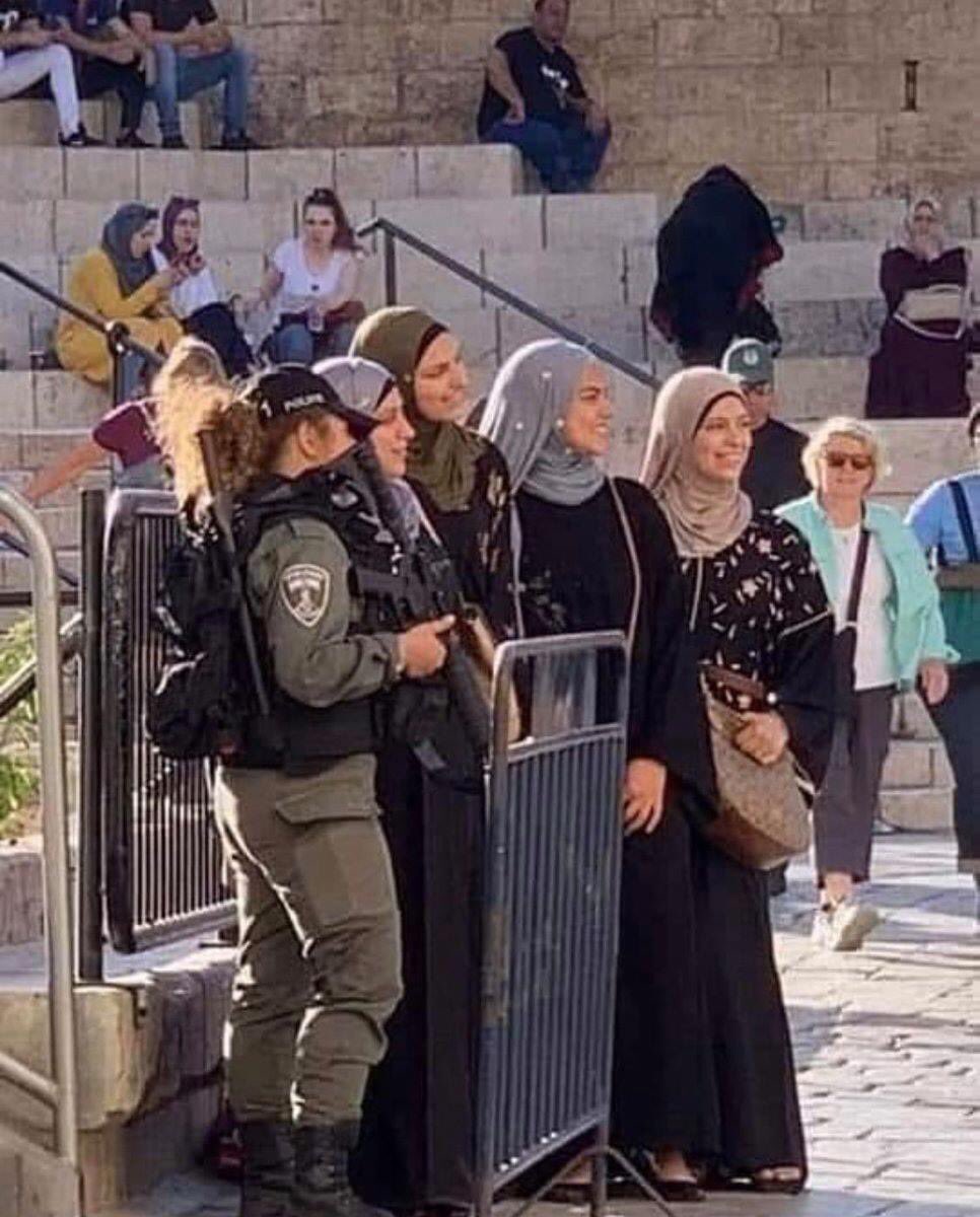 HertfordshireI's tweet photo. This is the real Israel you never hear about. Muslim women taking pictures with Israeli Border Police. Don’t believe the Jew haters. There is absolutely no evidence of apartheid in Israel. #BDSTears #JusticeforJews #SayNoToRacism #Israel https://t.co/WQmb6OTrv9