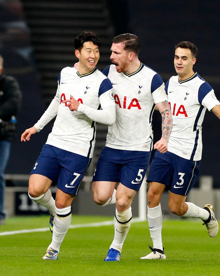 Son celebrates with Hojbjerg and Reguilon after scoring in the North London Derby