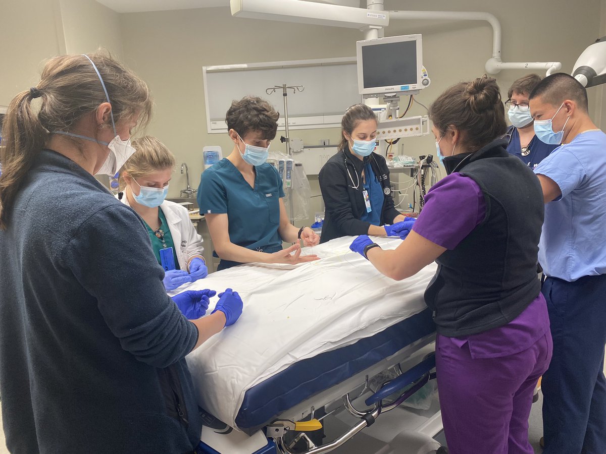 Dr. Monique Arvisais-Anhalt, PGY-2, teaches residents how to tie chest tubes during teaching rounds today with the residents in the trauma bay. Teaching rounds occur at 6:45AM every morning before 7AM sign-out and it gives a chance for seniors to teach about different topics.