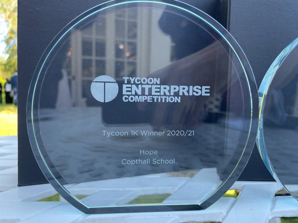 Copthall_School's tweet photo. They did it! @HopeCopthall made @dragonjones of @PJFoundation speechless with their determination, resilience and business drive. For the second time, our school brings home the trophies for #TycoonsinSchools. Winners of the #Tycoons1K AND #TycoonBusinessforGood awards. https://t.co/PnHHiZwtog