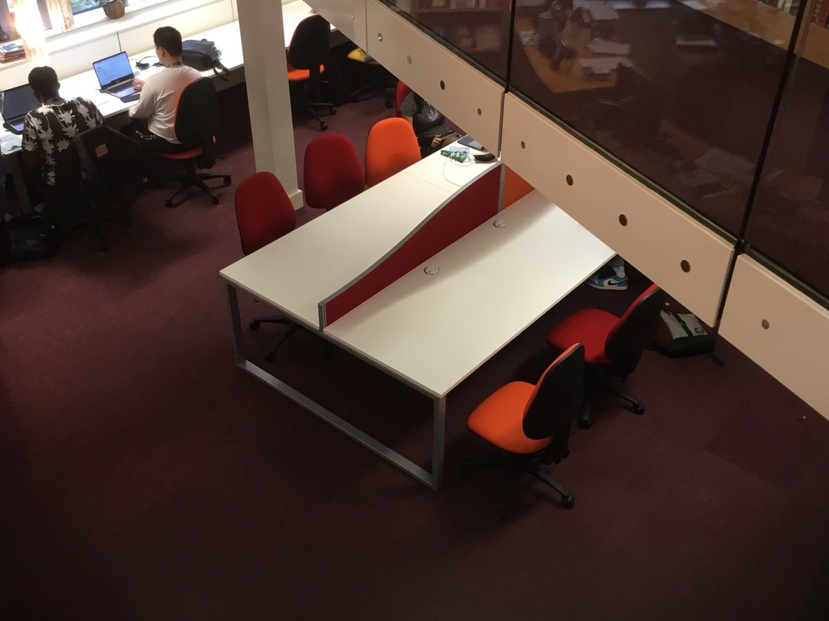 LibraryDeptCC's tweet photo. Students are enjoying our new look ground floor furniture. White desking and high benches are complemented by multi-coloured chairs, with power units for every student to charge their devices. https://t.co/qLstk6HdH1