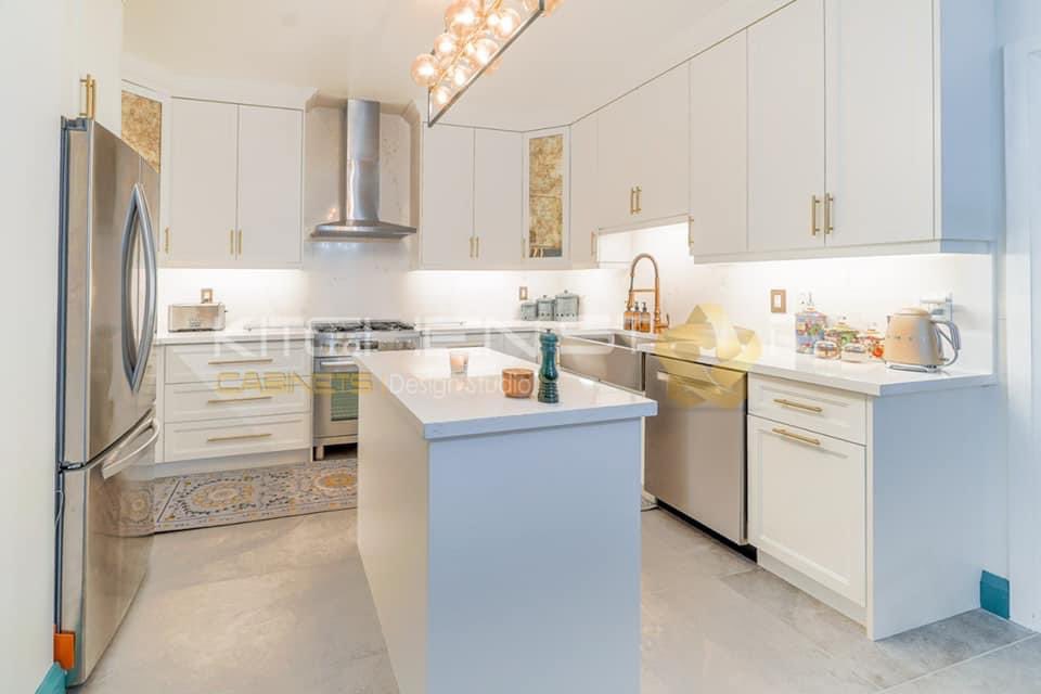 Custom crafted double shaker laminated mdf kitchen with custom glass inserts, quartz counter top and backsplash #kitchenstar #whiteshaker #lifestyle #furniture #customliving #torontohomestaging #quality