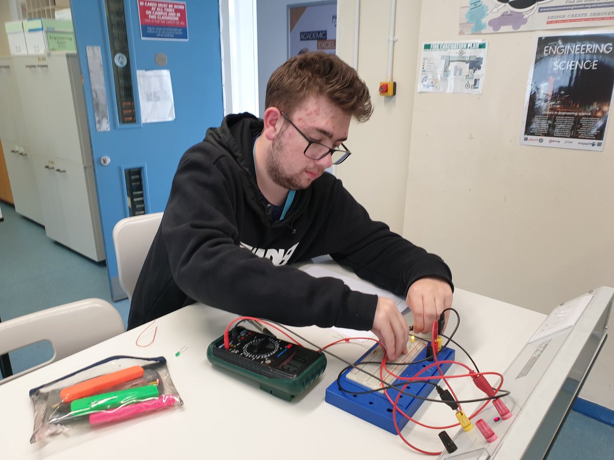 Electronics students lighting the first of many LEDs