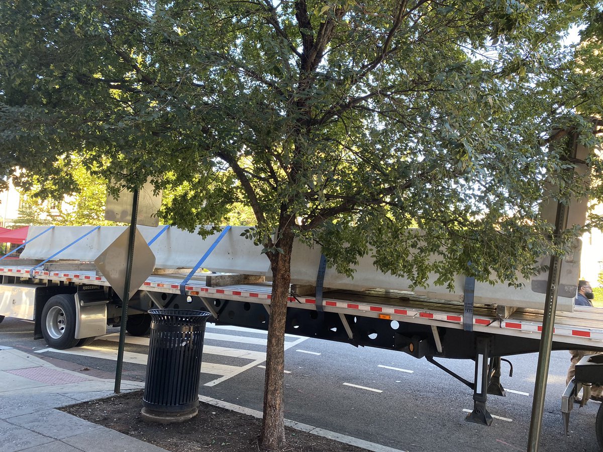 jillij's tweet photo. Adams Morgan Plaza: 3 Semi Trucks full of concrete barricades arrived at admo plaza early this morning - Truist bank vultures *again* tried to steal public land. No permits so they came at 5am. Destroyed a mutual aid tent and community art. Sick shame. Stopped by the people again https://t.co/cGPRwVlUpn