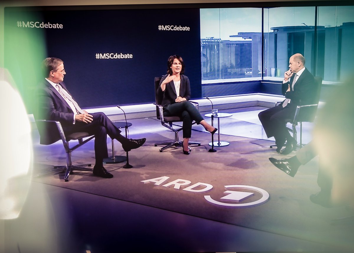 MunSecConf's tweet photo. Zu wenig außenpolitische Themen im Wahlkampf? Bei der #MSCdebate diskutierten @ABaerbock, @ArminLaschet und @OlafScholz ihre Vision für Deutschlands Rolle in der Welt. Hier nachschauen: https://t.co/tlQGE2LNNw #BTW21 https://t.co/kRlcGLyzrr