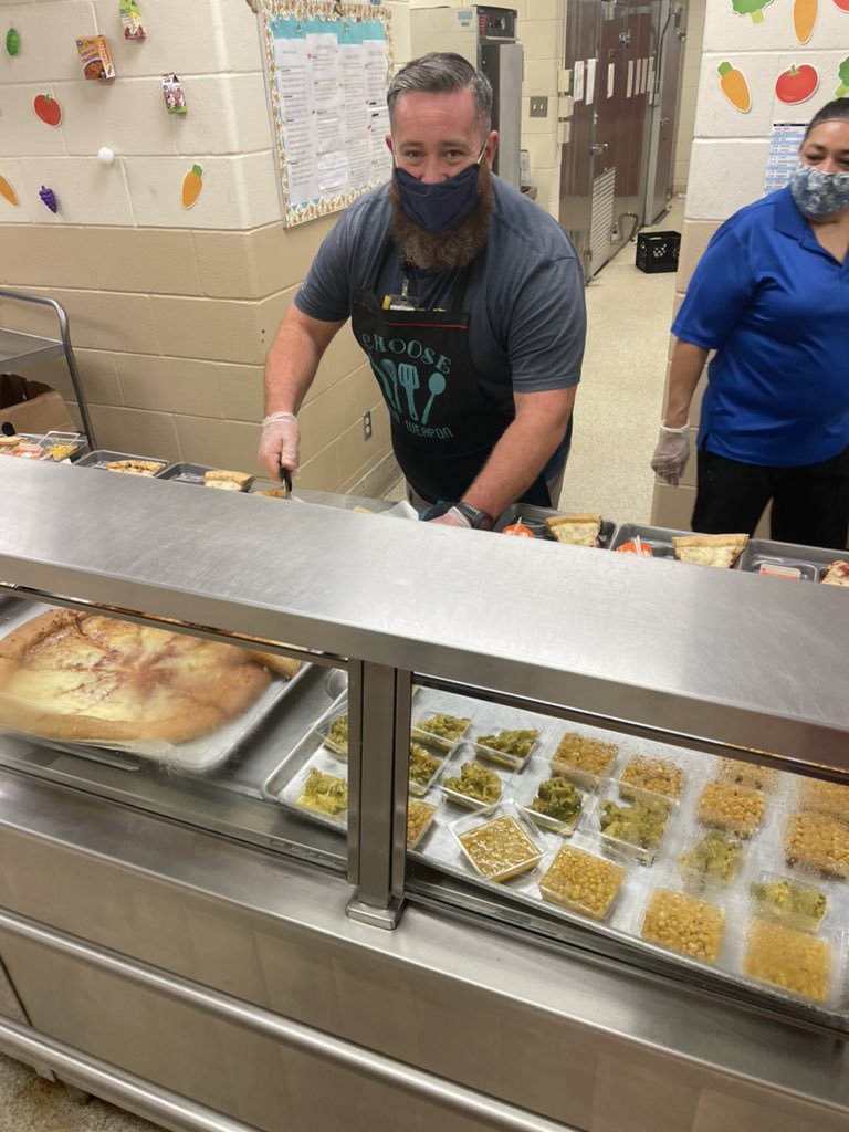 NISDCNE's tweet photo. When hearing that our cafeteria would be short staffed today, our amazing PE coach and IA jumped into action! They found time in their day to help out!!! WOW!!!! I’m sure the kids were thrilled to see you both serving up some pizza and veggies! #cnereunited https://t.co/dKpxkzO51A