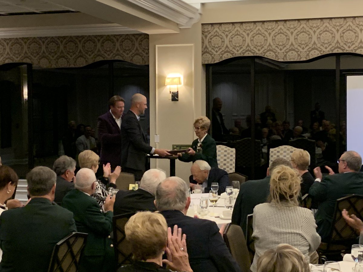Regional Affairs Director, Joe Foley, presents Marianne Reece with an award from the @USGA for her years of service to the game of golf.
