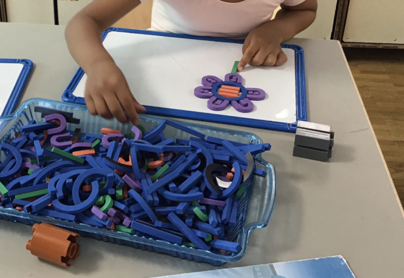 CisPreK's tweet photo. Pre-k B: These magnetic pieces when joined can make letters. The children have found their own way of playing with them, lots of mathematical thinking going on; shapes, symmetry, patterns #maththroughplay @CISDK https://t.co/DEGDkiUkIZ
