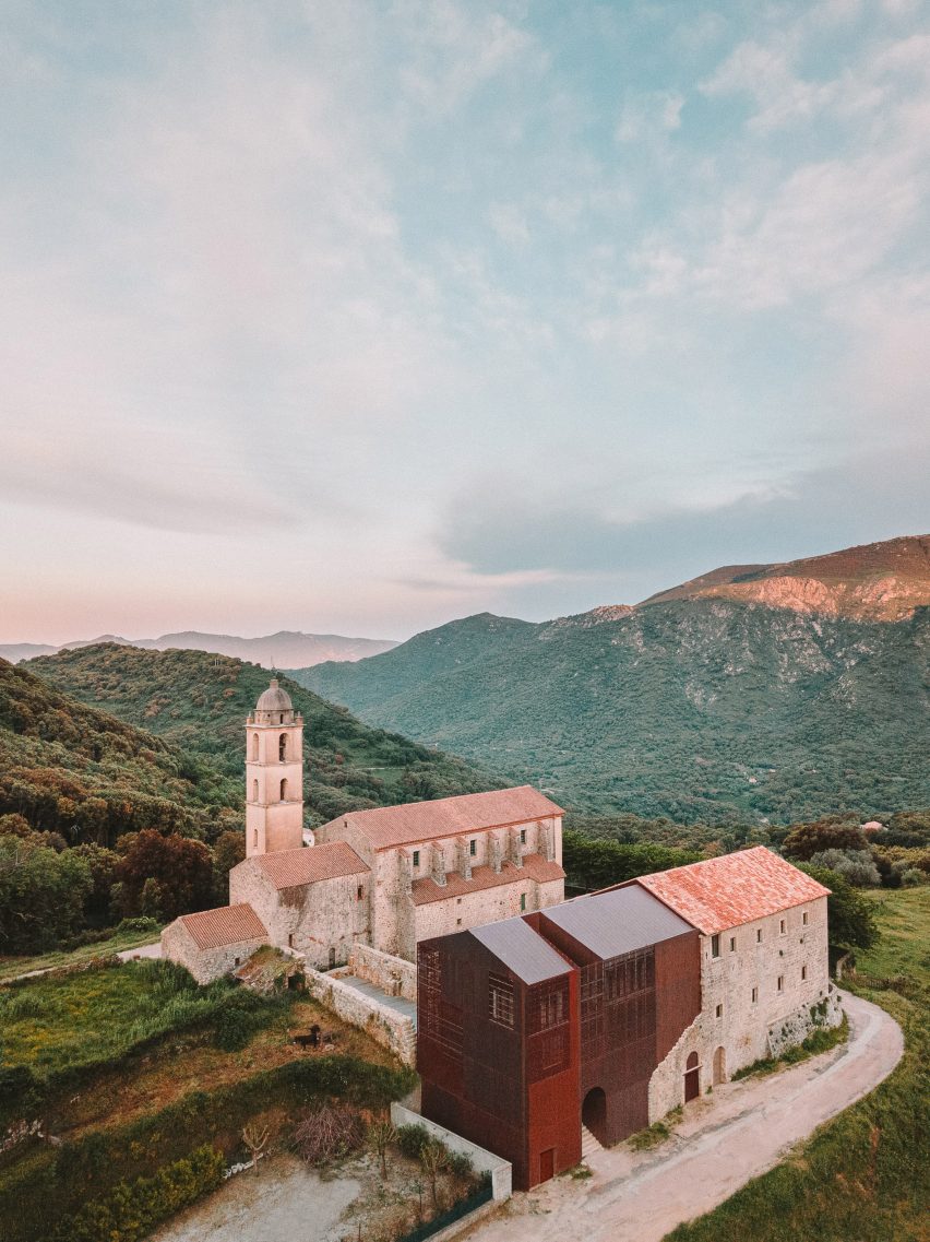 French studio AMELIA TAVELLA ARCHITECTES renovated and extended a 15th-century convent on the island of Corsica, adding a perforated copper volume. #design #architectureporn #interiordesign