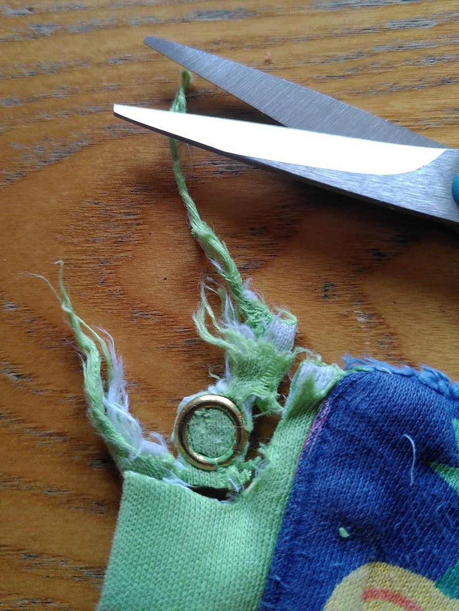 dnwood's tweet photo. I have a kid who chews collars. I've finally gotten around to mending what is otherwise a fabulous jumper; I even managed a replacement snap! So now the next kid can wear it, too! #ADHDmakers #MendItMonday https://t.co/5563Xoteoa