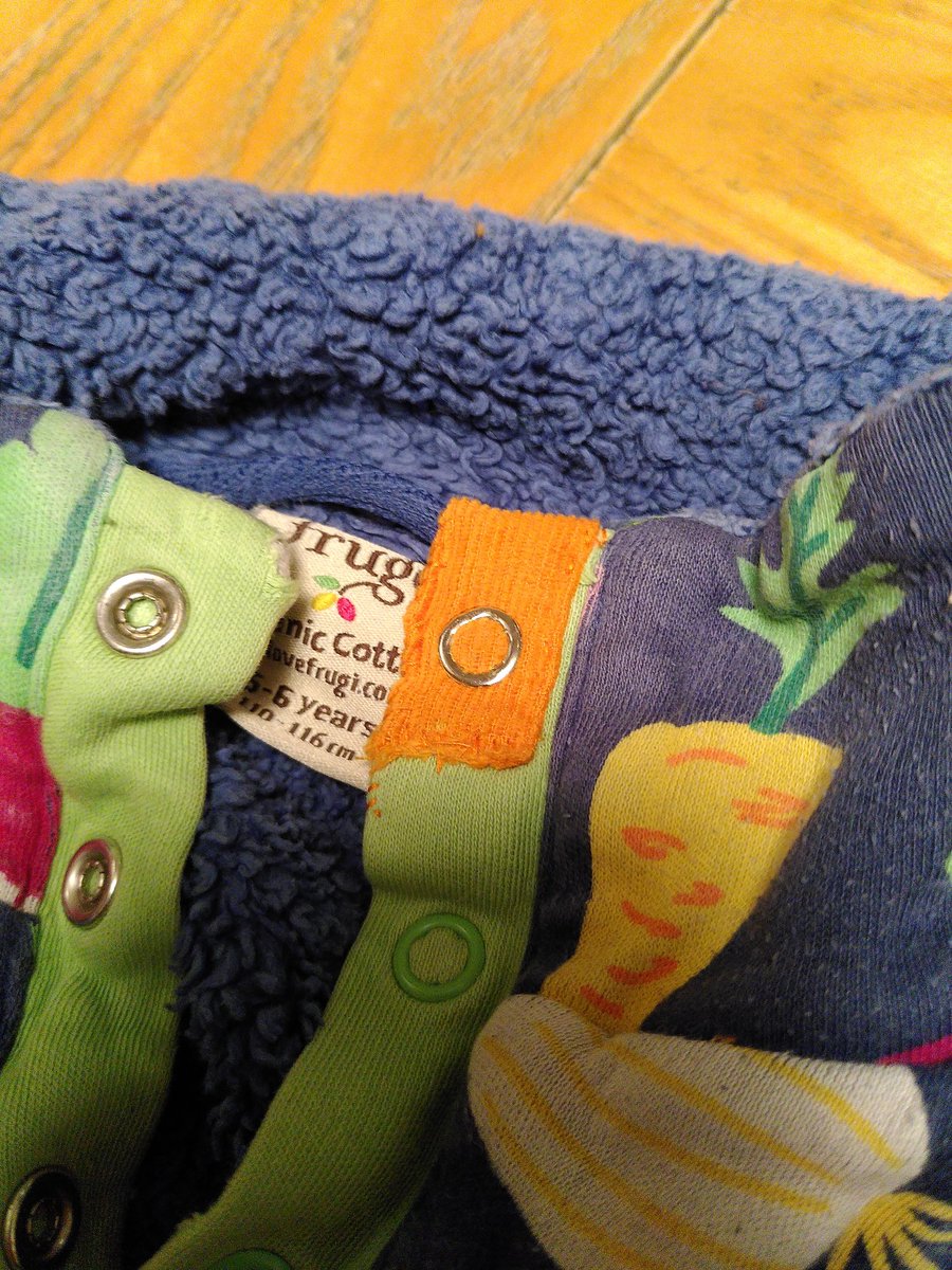 dnwood's tweet photo. I have a kid who chews collars. I've finally gotten around to mending what is otherwise a fabulous jumper; I even managed a replacement snap! So now the next kid can wear it, too! #ADHDmakers #MendItMonday https://t.co/5563Xoteoa
