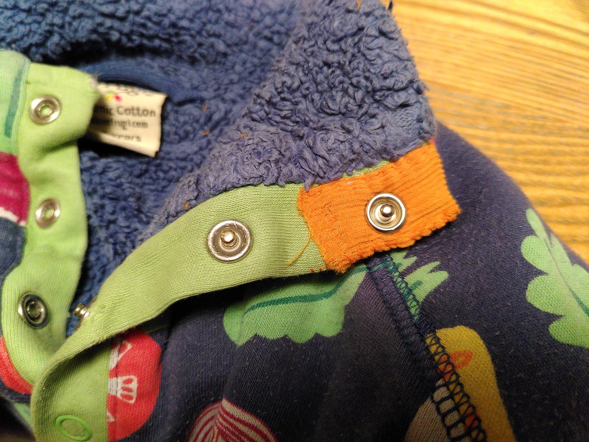 dnwood's tweet photo. I have a kid who chews collars. I've finally gotten around to mending what is otherwise a fabulous jumper; I even managed a replacement snap! So now the next kid can wear it, too! #ADHDmakers #MendItMonday https://t.co/5563Xoteoa