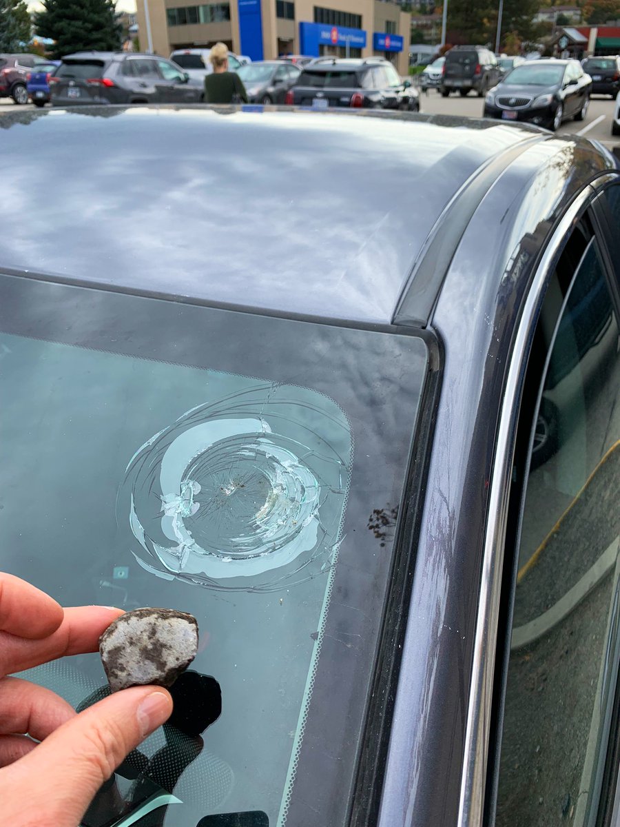 Putsky88's tweet photo. How the heck am I going to explain to ICBC that a crow just dropped a large rock onto my windshield at Winners parking lot?! 😠 🤯 https://t.co/BGlycLimPj