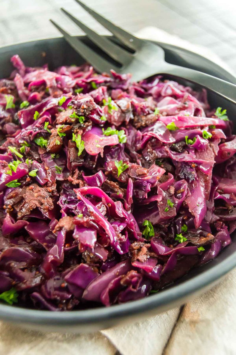 Authentic German red cabbage is a sweet and sour recipe that is often served as a side dish during Oktoberfest. It's easy to make  and is a different side dish for pork chops, chicken sauerbraten! #oktoberfest #braised cabbage westviamidwest.com/german-red-cab…