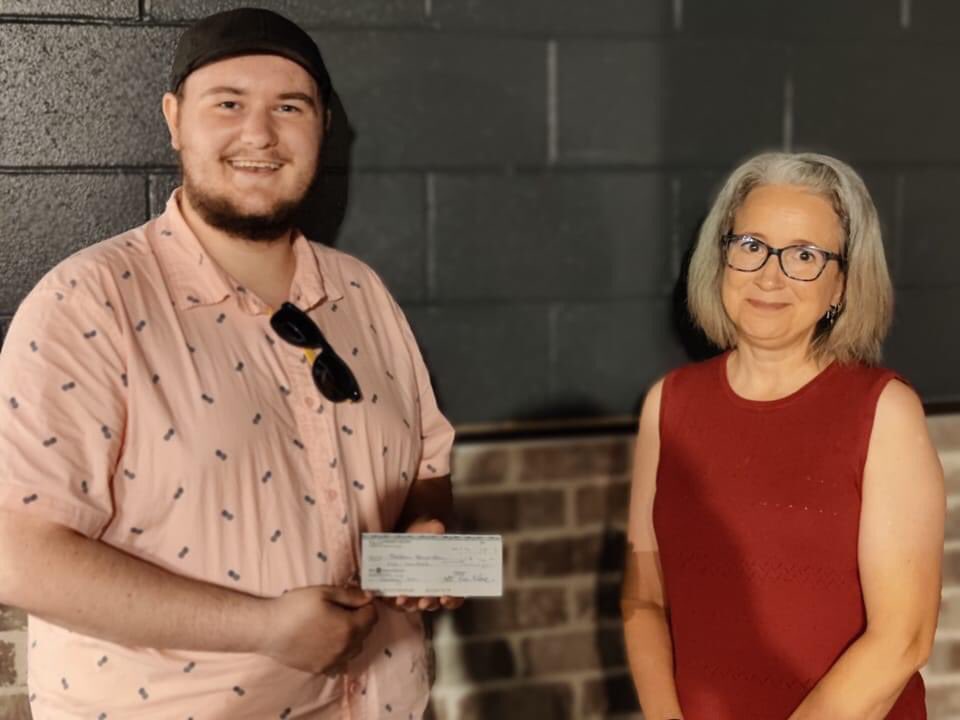 ACTPEI's tweet photo. ACT is proud to announce the inaugural recipient of the William McFadden Award for 2021, Bretton Bannister, seen here accepting a cheque in August from ACT's Past President Marti Hopson . Congratulations Bretton! #communitytheatre #actpei #theatrepei https://t.co/Kd9ERRAXpj