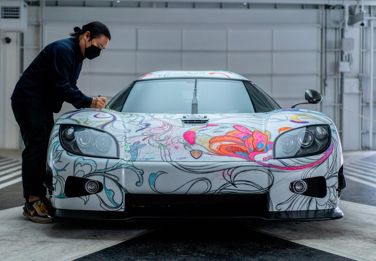 mixtus's tweet photo. Art is a magical force✨  @JamesJeanArt coloring the “2nd fastest art car coloring book”. This is the @koenigsegg CCX known as Big Brother wrapped with Jame’s art. Proceeds go to the Festival of Children Foundation. 🙏 @timcadiente for pushing boundaries. #art #artcar #jamesjean https://t.co/4jFfkMw082