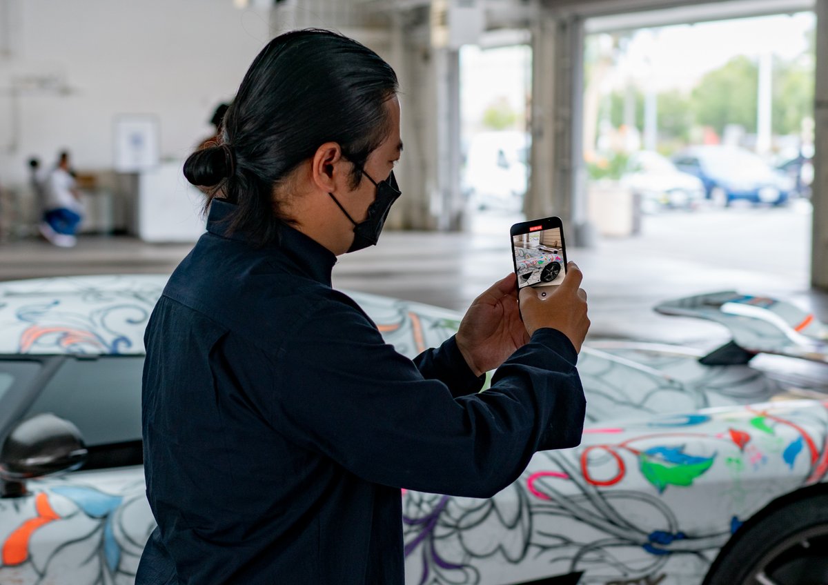 mixtus's tweet photo. Art is a magical force✨  @JamesJeanArt coloring the “2nd fastest art car coloring book”. This is the @koenigsegg CCX known as Big Brother wrapped with Jame’s art. Proceeds go to the Festival of Children Foundation. 🙏 @timcadiente for pushing boundaries. #art #artcar #jamesjean https://t.co/4jFfkMw082