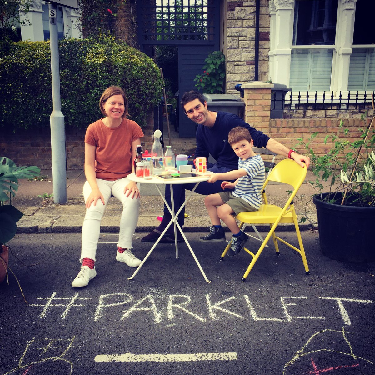 AmandinLondon's tweet photo. We created a parklet outside our house yesterday as part of #PeopleParkingDay. We catched up with neighbours and generally had a good time. We need more space for people and plants and less space for cars! @LondonParklet #Harlesden #NW10 #ParkletsNowPlease https://t.co/s2k57VBfi7