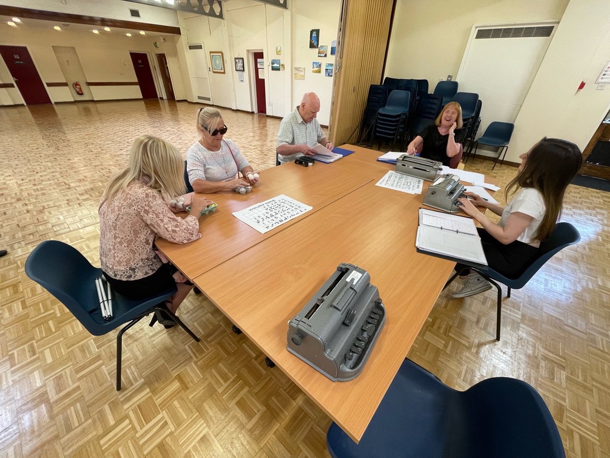 Monday morning Braille Group making the most of golf balls and egg boxes to replicate a Braille Cell