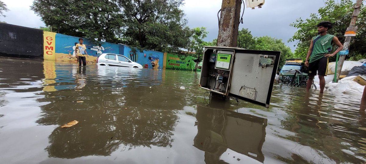 nivi15's tweet photo. A flooded street with water levels rising dangerously close to the open power box at Vellampeta following a heavy downpour that lashed #Visakhapatnam under the influence of #CycloneGulab. @GummallaSrijana @GVMC_OFFICIAL @the_hindu https://t.co/3nKhct4CXo