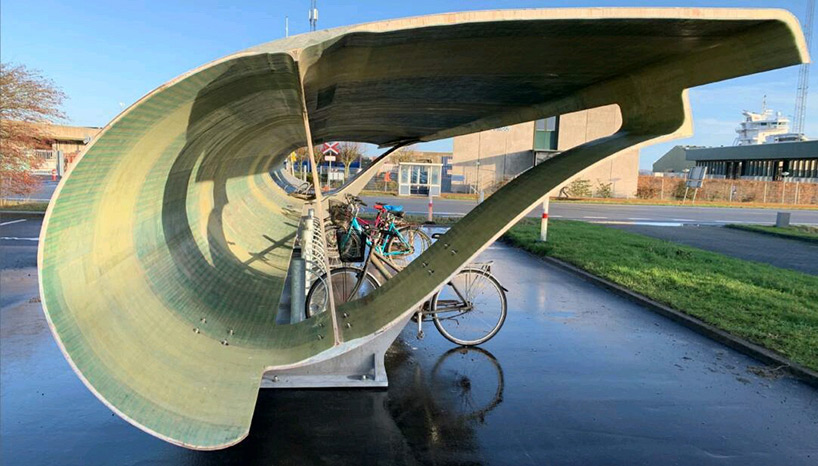 designboom's tweet photo. denmark is repurposing discarded wind turbine blades as bike shelters
https://t.co/LIvZTZxgIo https://t.co/Oh4TH6vTVm