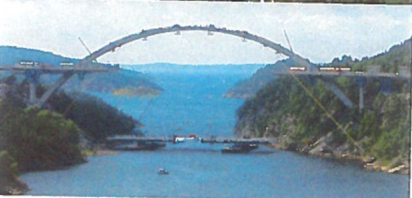 Sarens's tweet photo. What a fantastic view! Installation of the new #SvinesundBridge in #Norway in 2004 required Sarens’ #Cranes and #StrandJacks to complete all elements of #Construction. #SarensSaturdays https://t.co/tlZPZtxCAZ