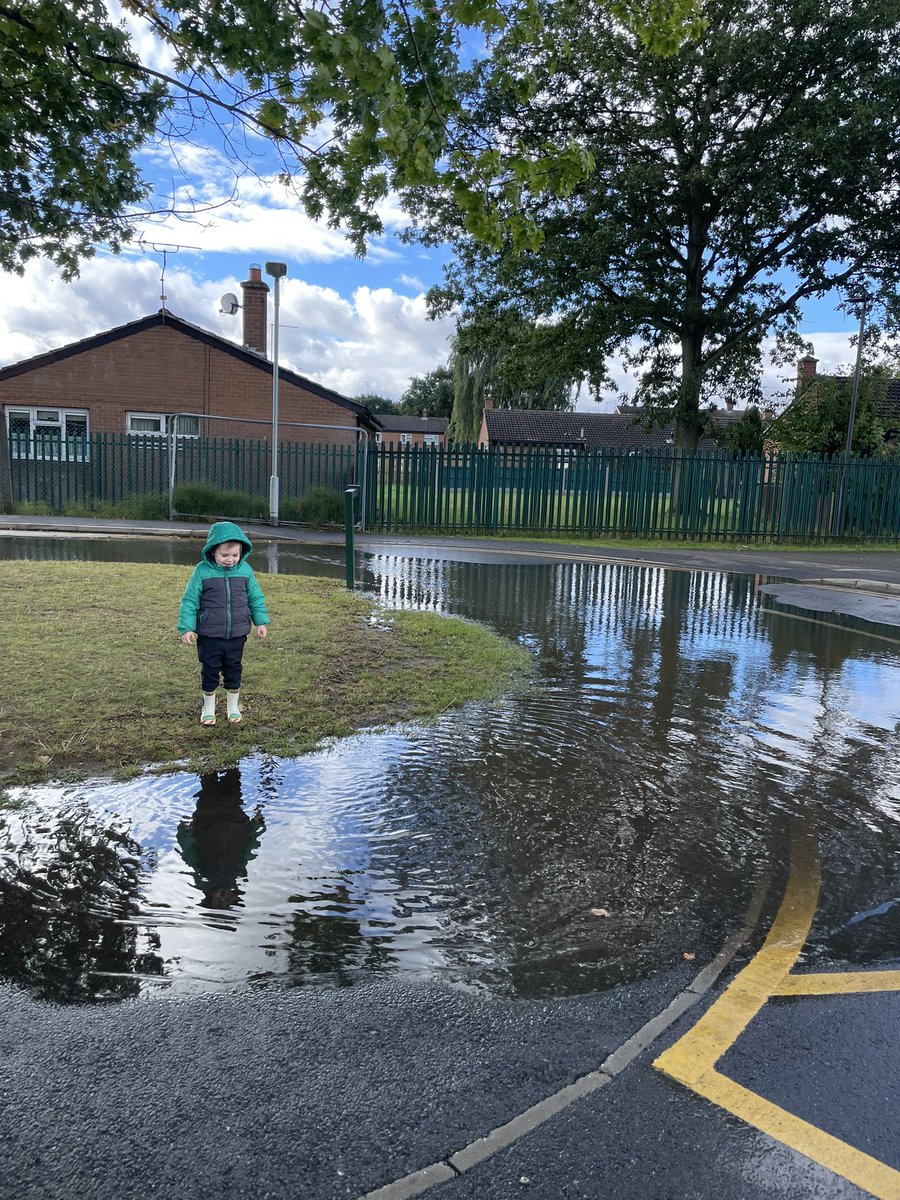 William enjoying a ginormous puddle outside school!