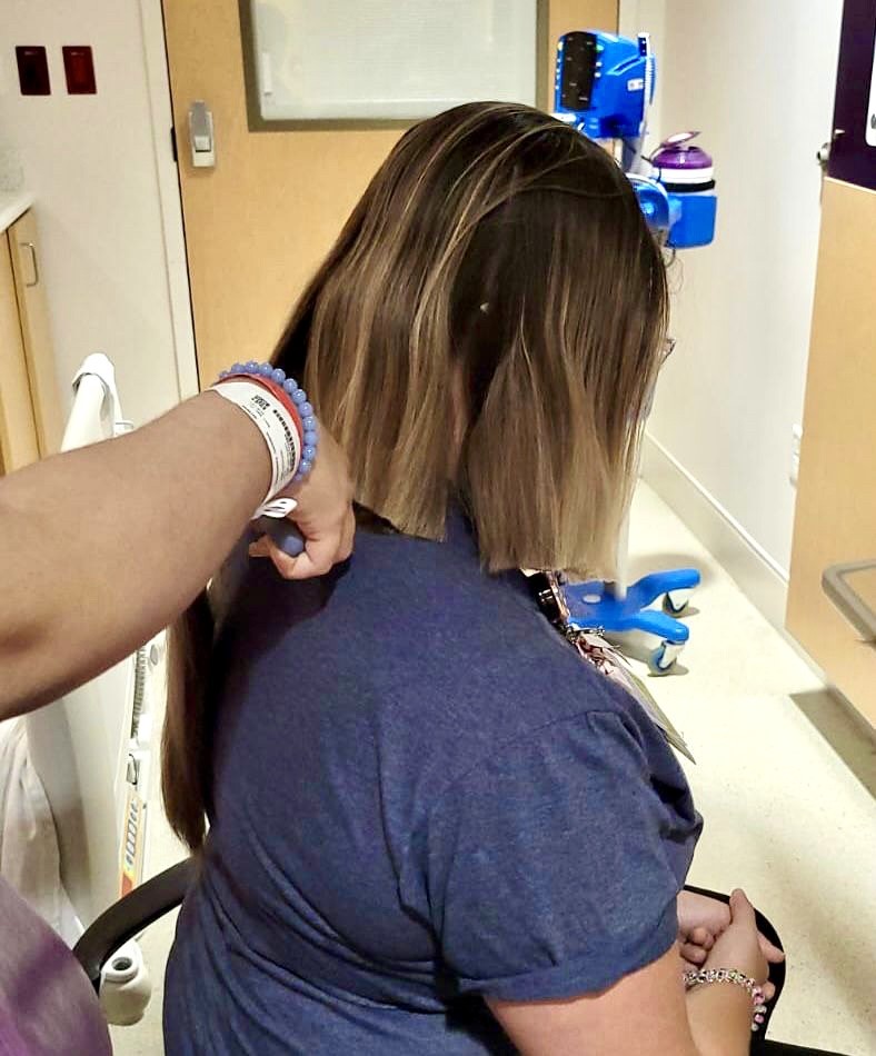 ExpertKidsCare's tweet photo. In honor of #ChildhoodCancerAwarenessMonth, Stephanie Epstein (@Stephanie_MTBC ), a pediatric music therapist at Holtz Children's Hospital, let an oncology patient cut her hair to donate to Children With Hair Loss (@CWHL_org). Thank you for sharing this inspiring moment with us! https://t.co/s7dkpvlyOD