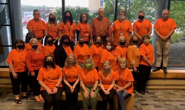 TomMugford's tweet photo. Programs and Services Division of EDU wear orange 
 at the start of Truth and Reconciliation Week! Orange Shirt Day is September 30. #EveryChildMatters #orangeshirtdaynl https://t.co/MOABGpTcgj