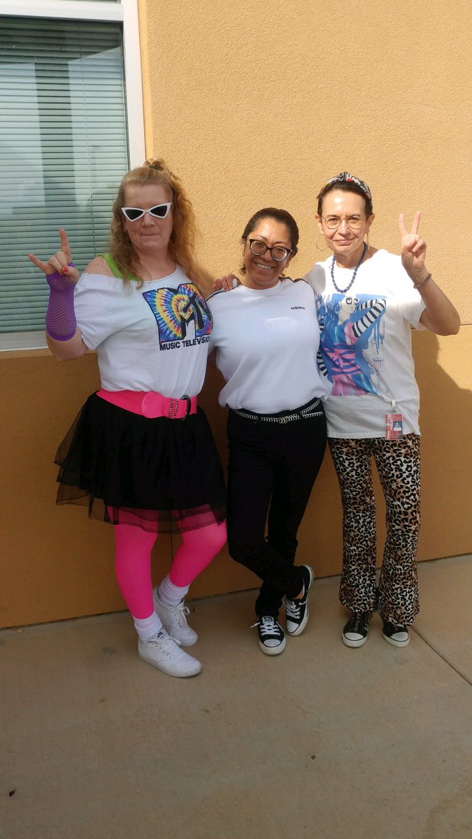 TrumanTigers24's tweet photo. The secretaries showing off their 80โs gear for SPIRIT week! #THUNDERspirit @ABQschools @APSLZ3 https://t.co/j19Z3RoWA2