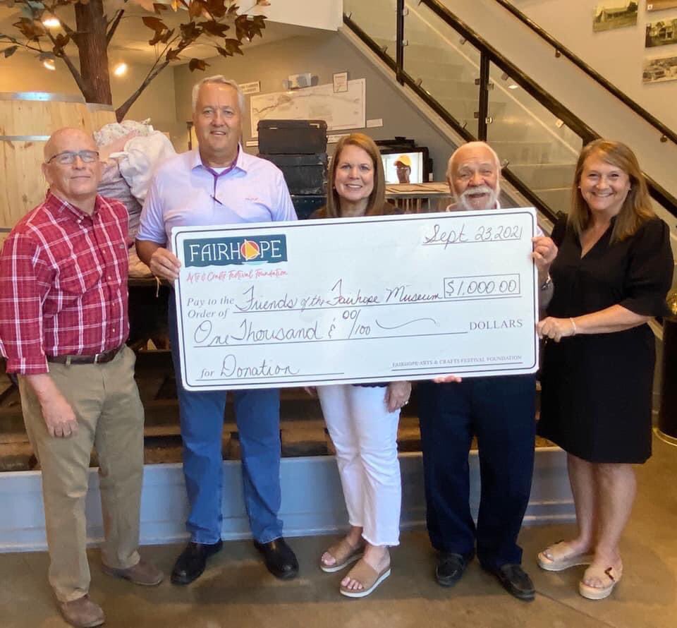 FhopeACFest's tweet photo. This is why we do what we do! 🙌🏻The Fairhope Arts &amp; Crafts Festival is proud to present the Friends of the Fairhope Museum of History with a $1,000 donation. 
Remember, when you support the Fairhope Arts &amp; Crafts Festival, you’re supporting our community! https://t.co/dAZJbojxk6