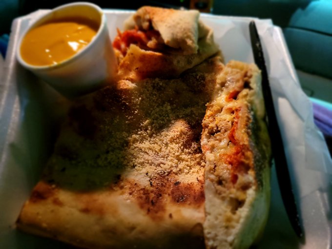 This pizza is unreal. I've never been served a piece of pizza with a fork. I definitely needed one too