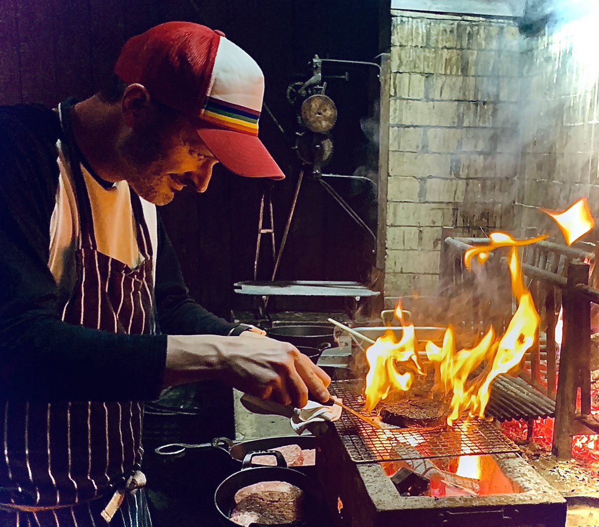 CXDquanac's tweet photo. MAN WITH FIRE: The incomparable @FredSmith_ at the grill of @flatironsteak, raising burgers &amp; £s for @felixprojectuk 

@dochall @amdat @missg_ray @willyates76 https://t.co/c8JN7NVepw