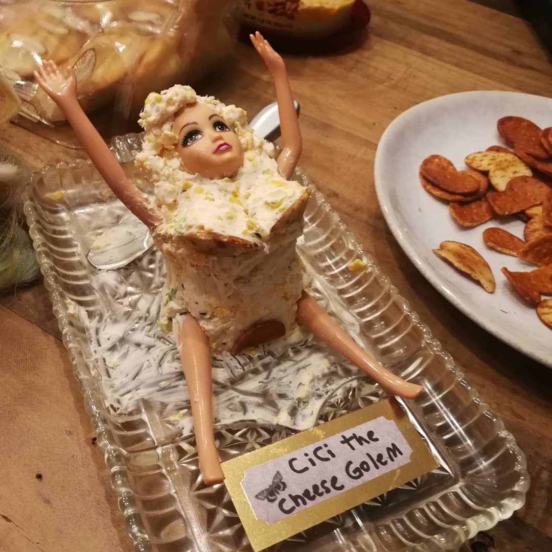 This is Cici the #cheese golem. She sacrificed a good portion of her body to satisfy the SYBARITE launch party attendees. paranormalsmutclub.gumroad.com
