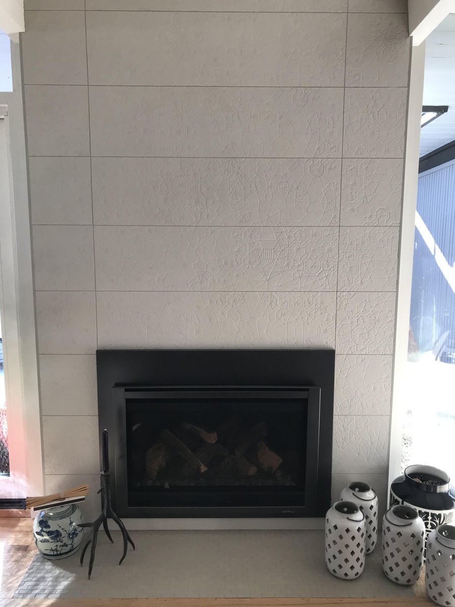tiling_expert's tweet photo. Fireplace: we installed 12x36 porcelain tile on the fireplace surround with schluters on all open edges. 

#experttouchtiling #denvertiles #porcelaintiles https://t.co/dBq4f19eXS
