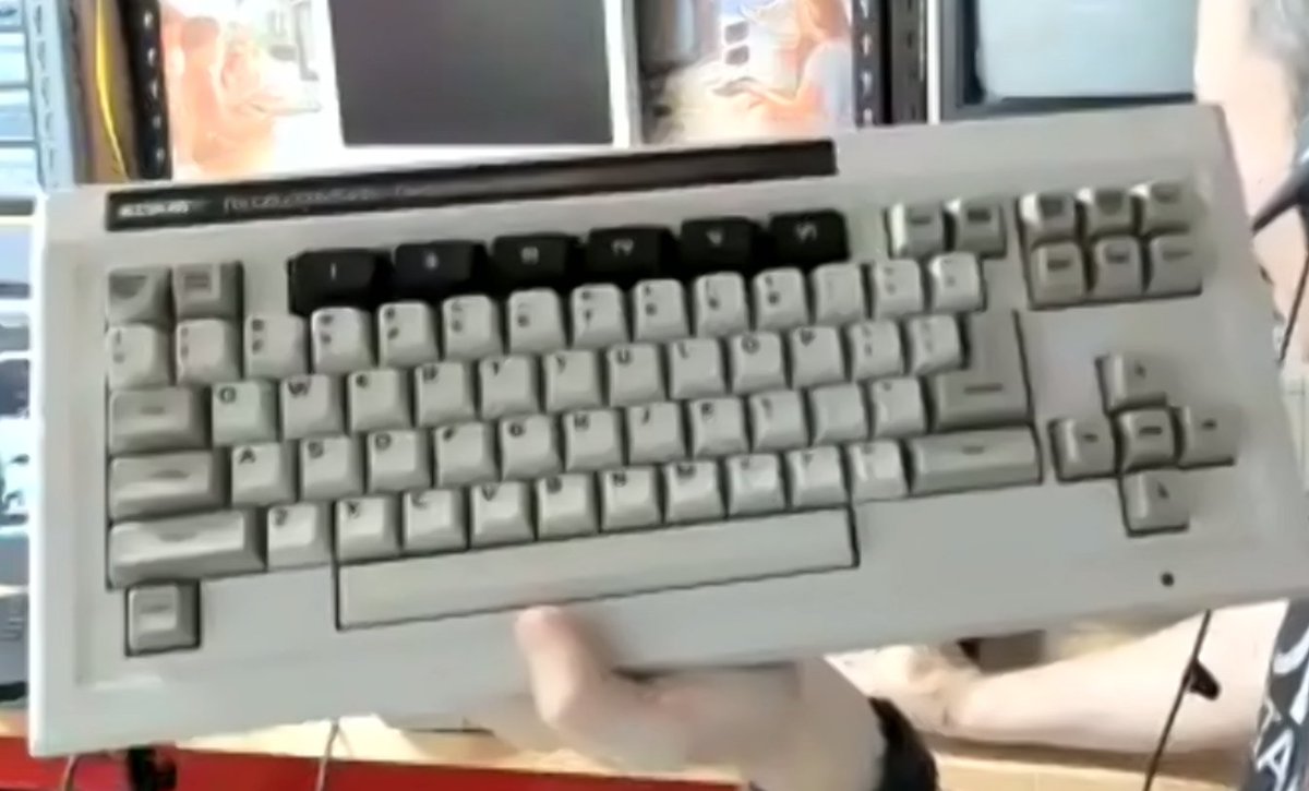 AmigaL0ve's tweet photo. At the last @seaccclub C= Club meet we got a demo of the mintiest Coleco ADAM I've seen since '83. Yep the computer that needs the PSU from its printer to work. Fires up in "Typewriter Mode." White controllers (can double as a brutal num-pad)! Dual cassettes! And Coleco carts FTW https://t.co/XPTEXkRdYY