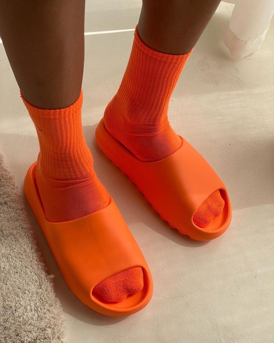 yeezy slide orange on feet