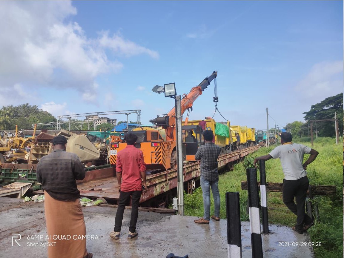 A goods train carrying equipment for the construction of  Roads dispatched from Jabalpur  arrived today at Kannur today (29.09.2021).  The goods train with 31 flat wagons brought , Excavators,  blue metal crusher units,  bitumen mixing plants, ready mix units and 30 trucks.
